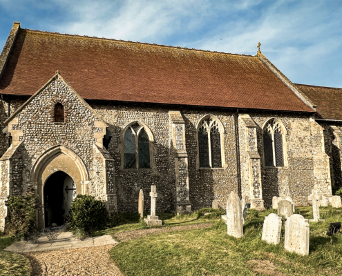 All Saints Church, Mundesley, September late afternooon. Wide angle photo